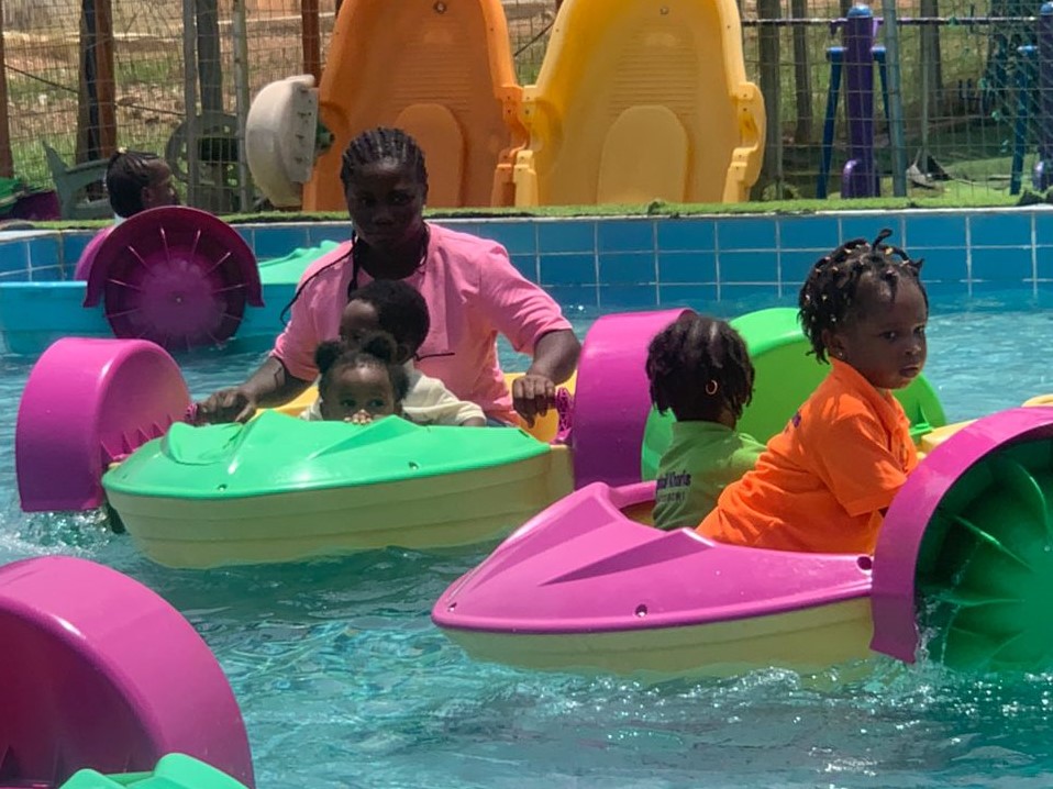 Children enjoying boat rides with their
                        teacher