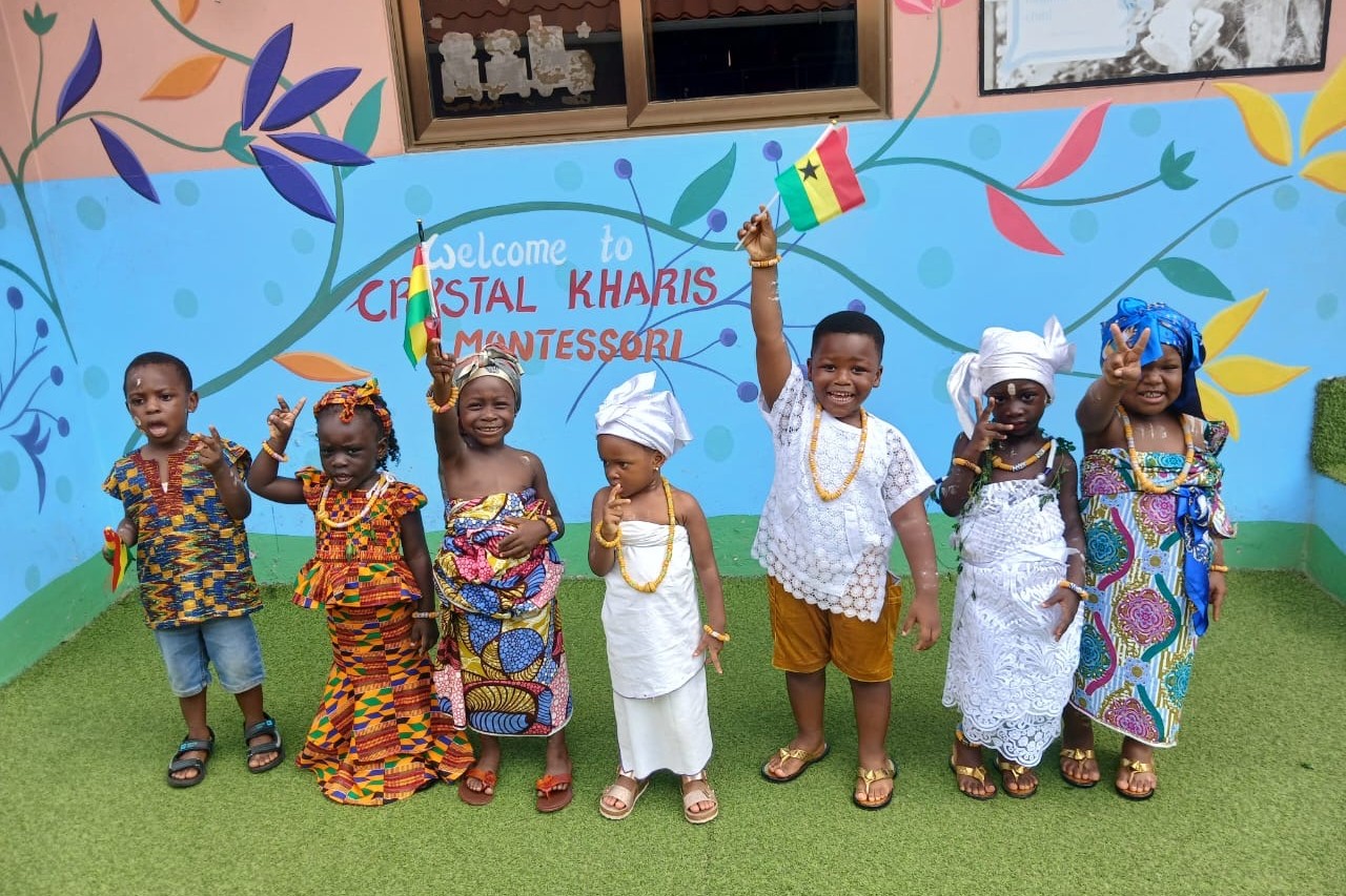 five students with a trophy and medals